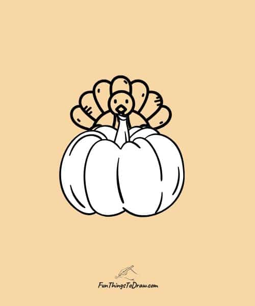 Turkey hiding behind pumpkin drawing