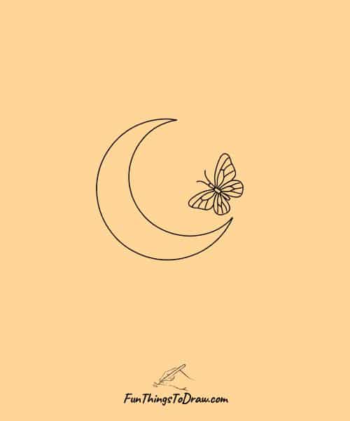 Butterfly flying near a crescent moon