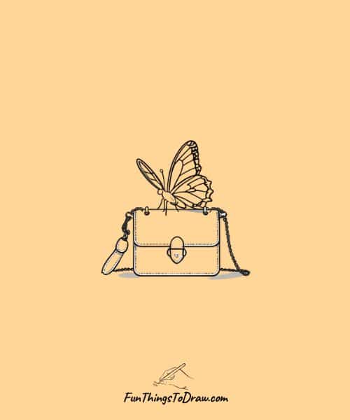 Drawing of butterfly sitting on a handbag