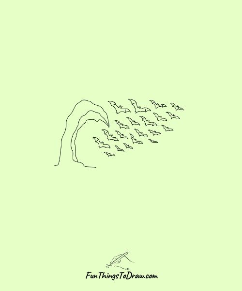 Bat colony flying from cave