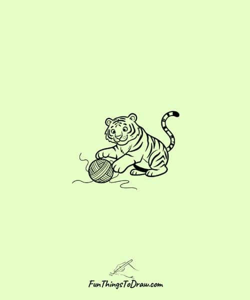 Tiger playing with a ball of yarn