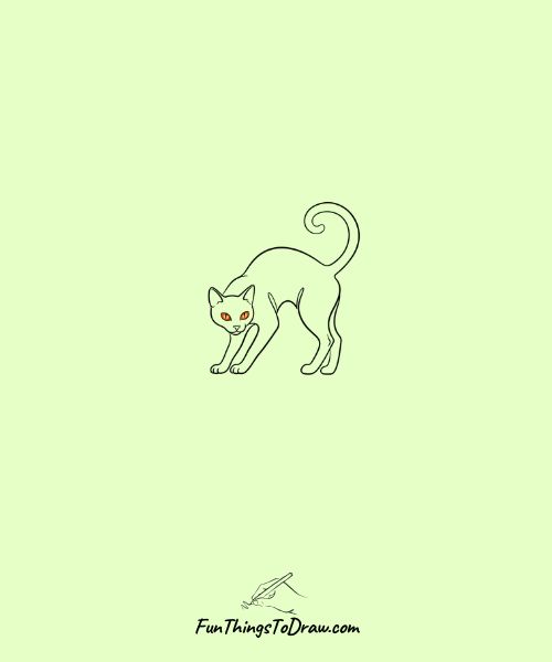 Black cat with arched back and glowing eyes